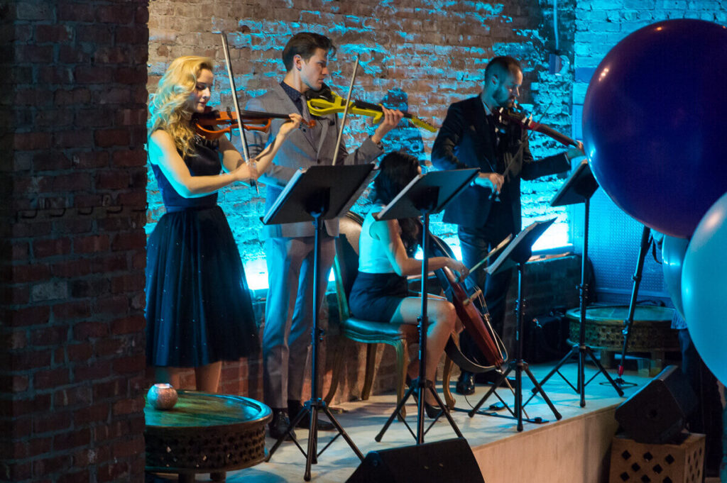 Charleston Virtuosi Electric String Quartet. Fashion event on King Street during Charleston Fashion Week 