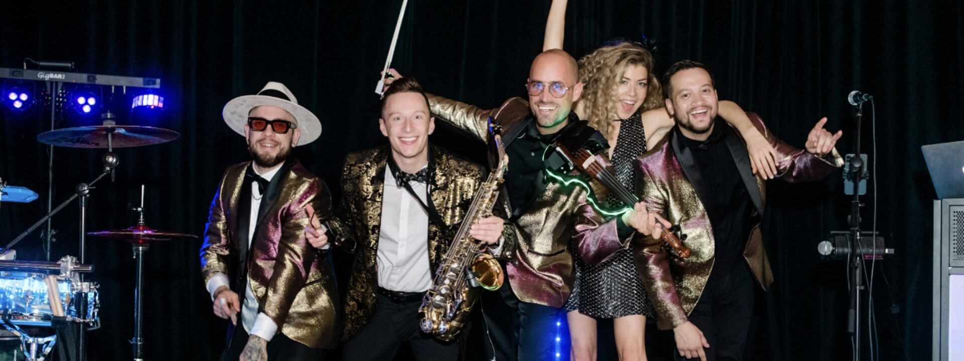 Wedding Hybrid DJ group with saxophone player, electric violinist, percussionist, and vocalist performing in Charleston, SC at the American Theater | Charleston Virtuosi