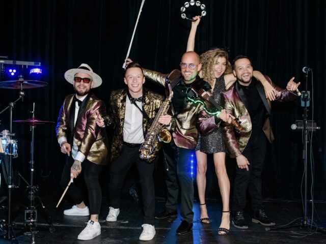 Wedding Hybrid DJ group with saxophone player, electric violinist, percussionist, and vocalist performing in Charleston, SC at the American Theater | Charleston Virtuosi